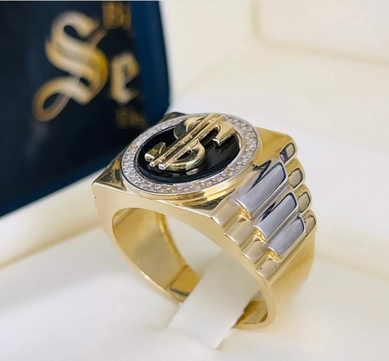 Dollar sign ring