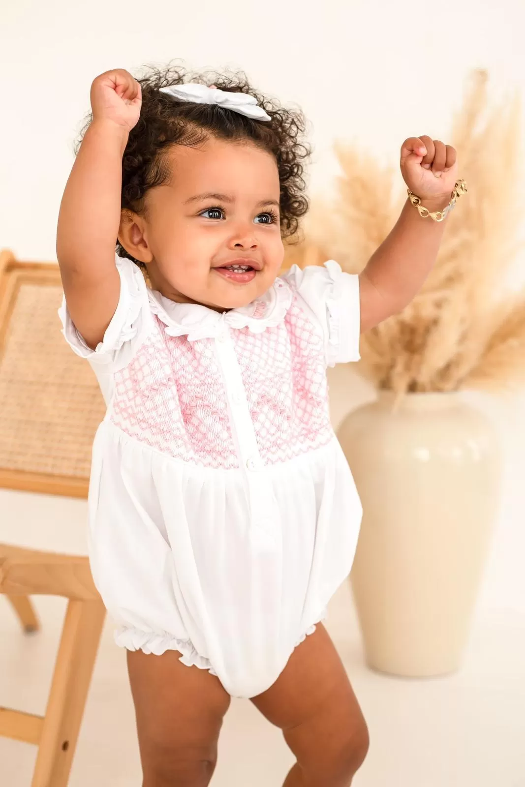 Girls White Smocked Romper Trimmed With Pink