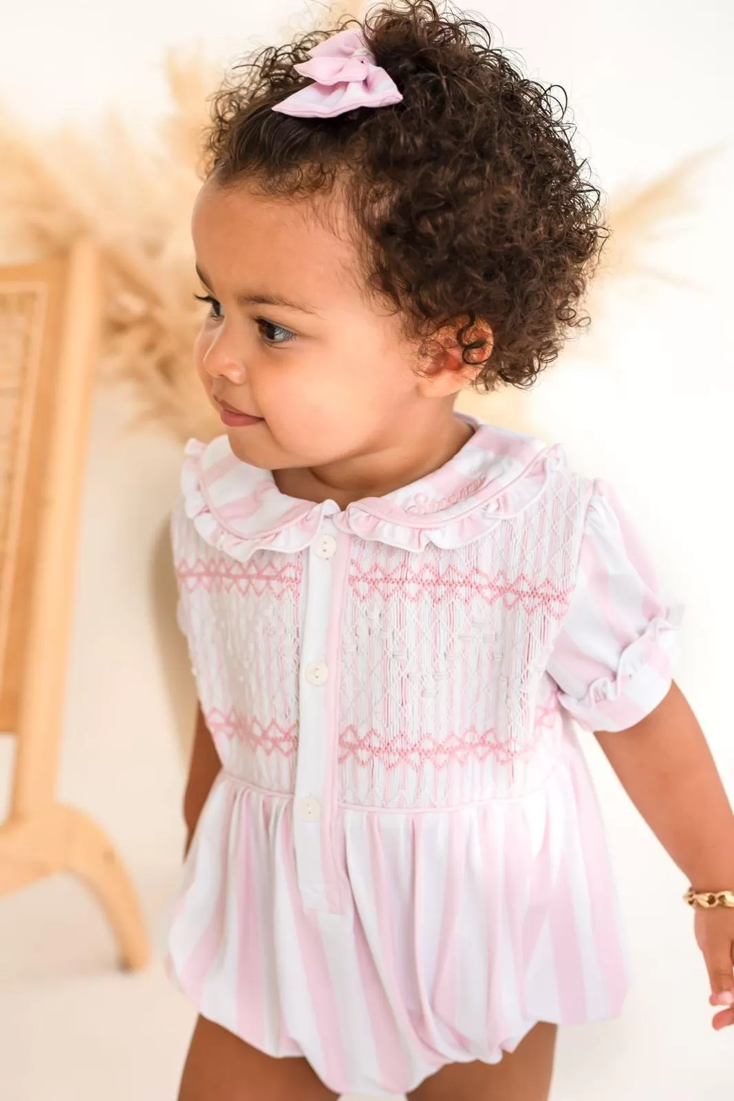 Girls White Smocked Romper Trimmed With Pink