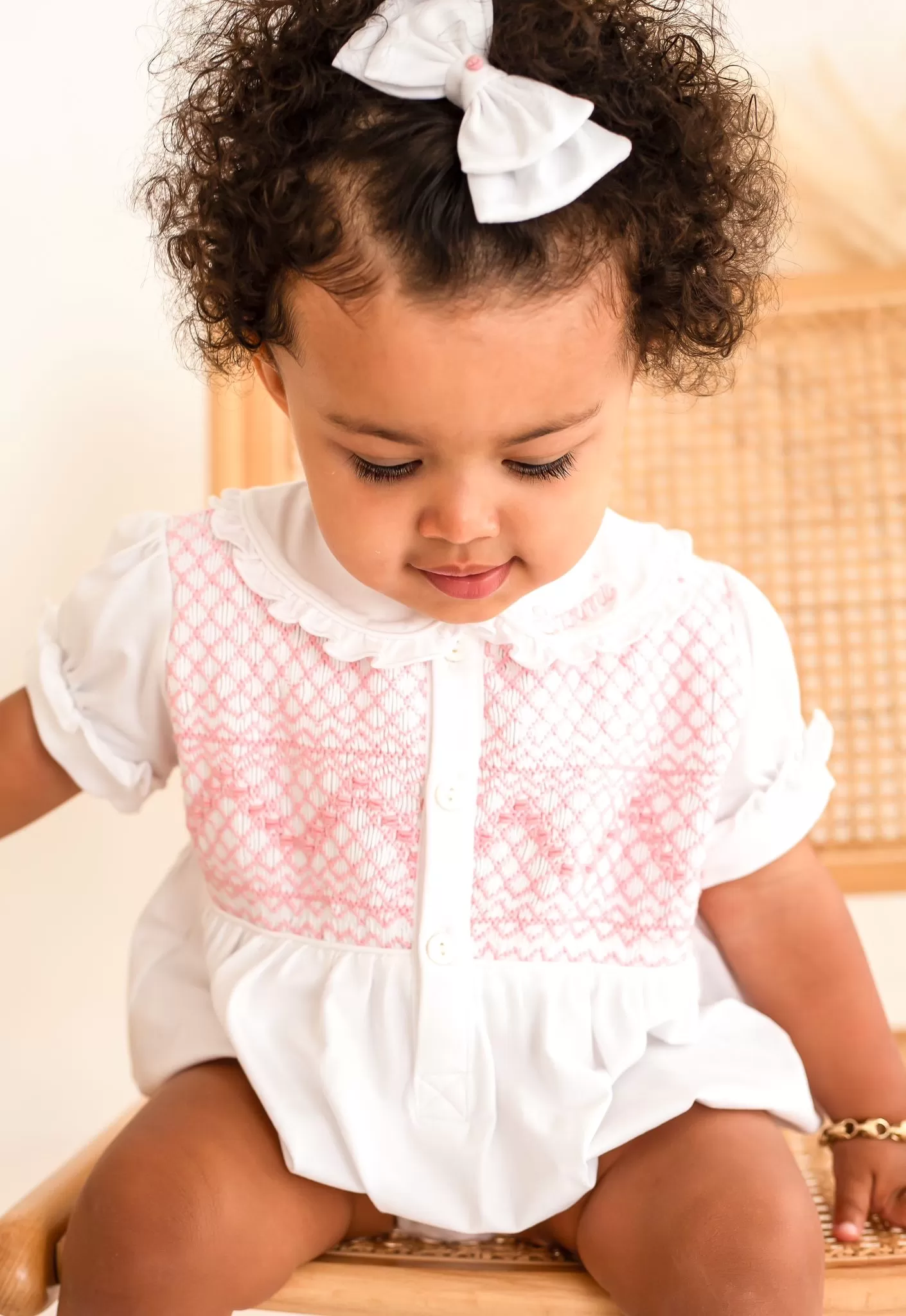 Girls White Smocked Romper Trimmed With Pink