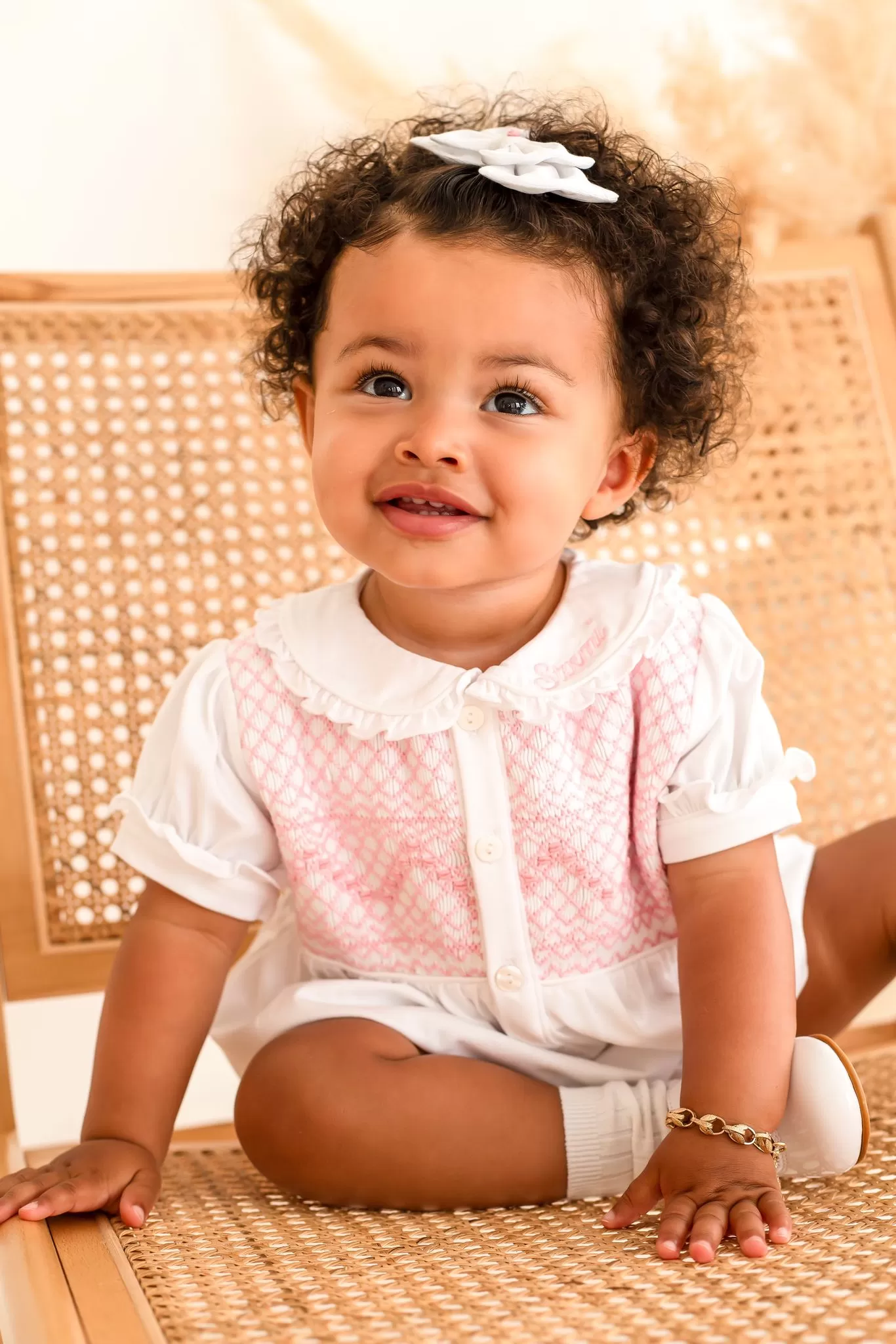 Girls White Smocked Romper Trimmed With Pink