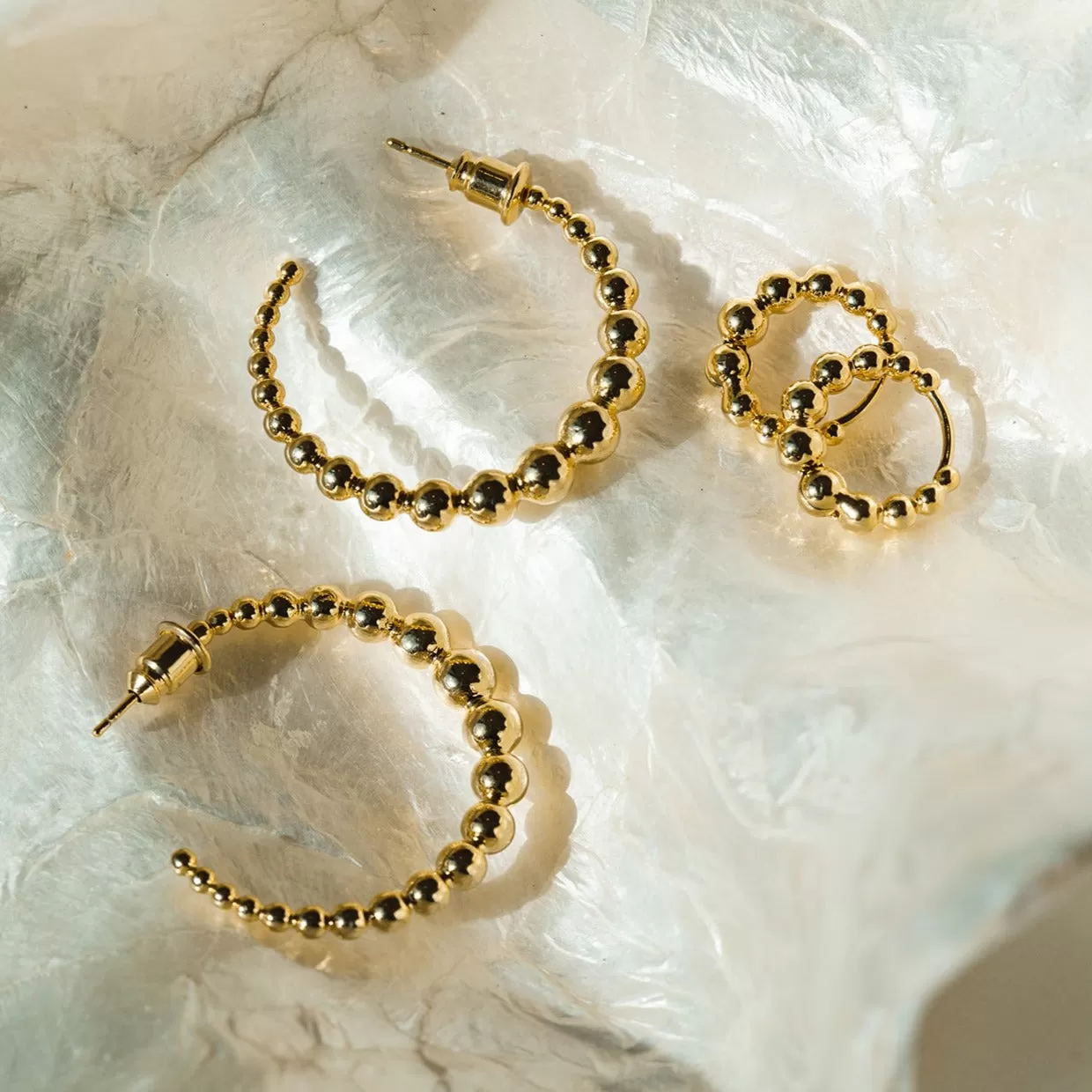 Large Graduated Orb Hoop Earrings