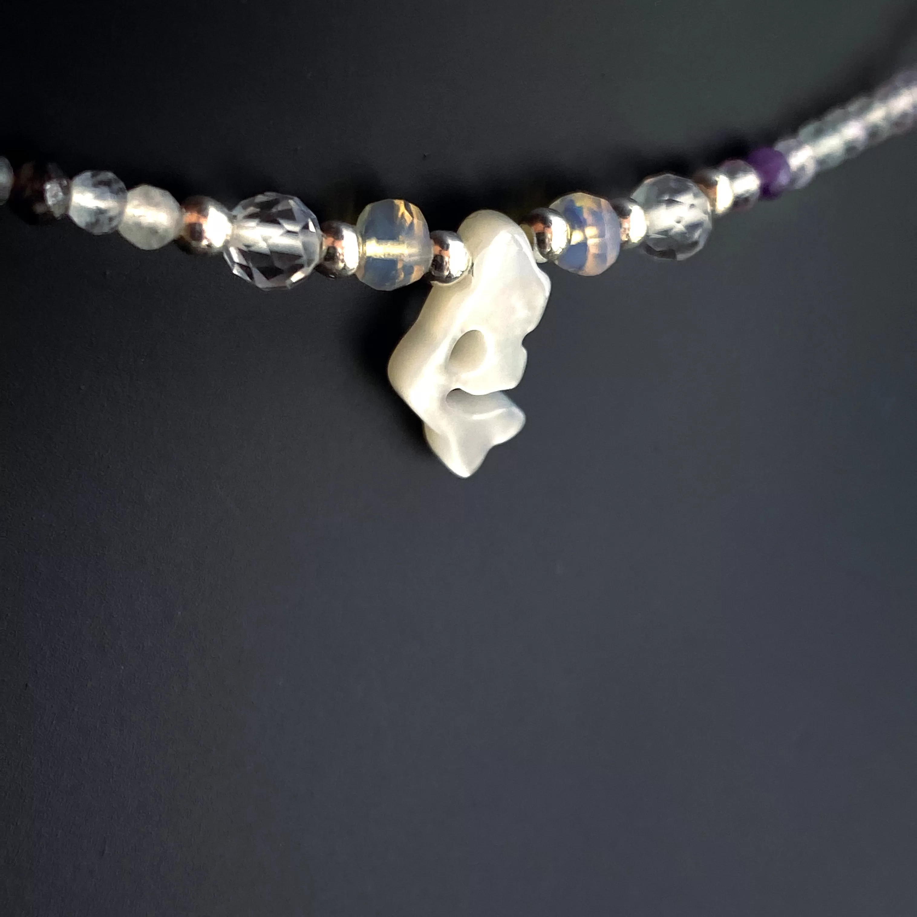 Mother of pearl mermaid on rainbow fluorite with Ethiopian opals, white topaz and sterling silver.